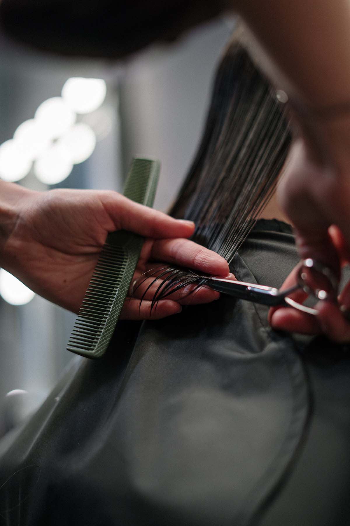 hair stylist cutting hair