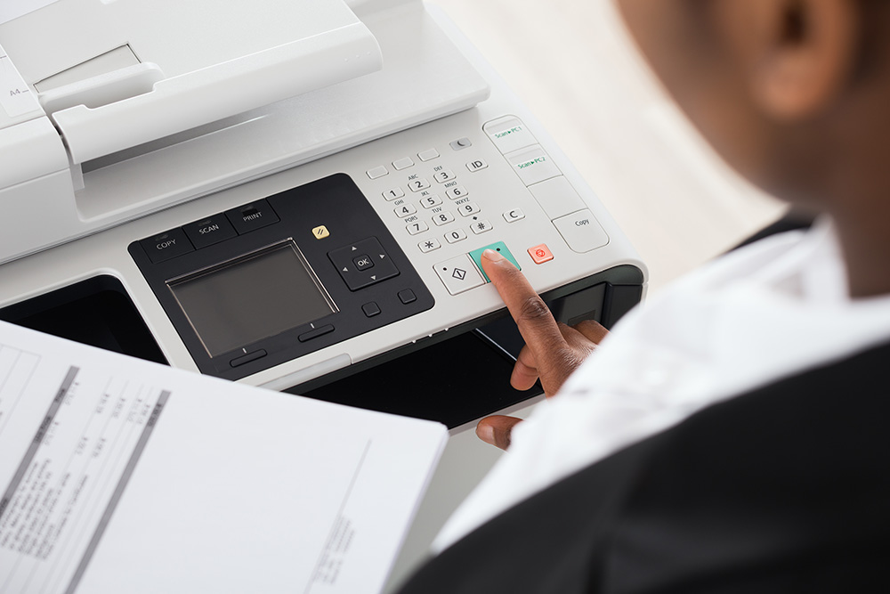 A person using a copying machine